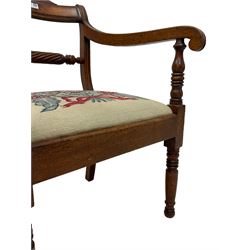 Regency mahogany elbow chair, rope-twist centre rail flanked by scrolled arm terminals, drop-in seat upholstered in floral tapestry fabric, raised on ring turned supports