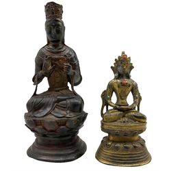 Chinese bronze figure of a Deity, in Ming style, seated wearing flowing robes and diadem on lotus base, with traces of polychrome gilt decoration H24.5cm, together with a Tibetan gilt bronze deity, inset with turquoise and coral coloured stones, on double lotus base (2)
