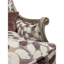 French design hardwood framed armchair, moulded frame with down sweeping arms on S-scroll carved arm supports, upholstered in trailing foliage design in shades of lilac and purple, twist-turned front feet, with small complimentary scatter cushion 