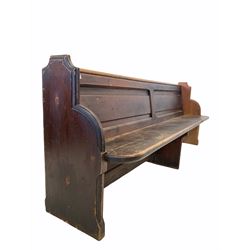 Large late 19th century stained pine church pew, the two panel back raised on shaped panel end supports W209cm