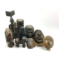Number of ebony and other carved African heads, African masks, plaster head etc