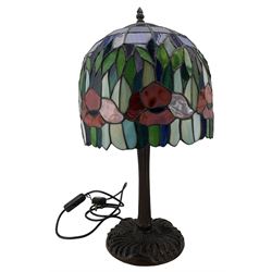 Tiffany design table lamp, with floral domed glass shade and bronzed base, H61cm, together with an Art Nouveau design bronzed side lamp with coloured glass shade (2)