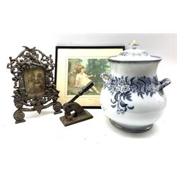 Early 20th century cast iron picture frame moulded with Putti, large lidded pot, Victorian cast iron press and a Bubbles print
