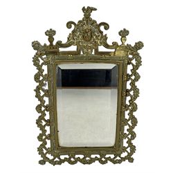 Pair of Victorian brass framed wall mirrors, each of upright rectangular form, cast with pierced floral and ribbon garlands, surmounted by a classical mask and flanked by two urns  of flowers, each with bevelled glass plates, H38.5cm x W23.5cm