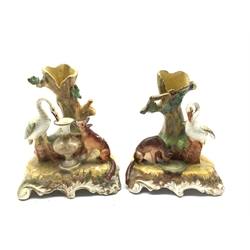 Pair of Victorian Staffordshire spill vases, each modelled as scenes from Aesop's fable The Fox and the Stork, H15cm