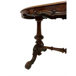 Late 19th century walnut stretcher table, shaped frieze with carved cartouche and scroll decoration, raised on twin pillars with lobe detail, cabriole supports with acanthus leaf carved united by turned stretcher
