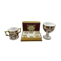 Royal Crown Derby Imari goblet and loving cup no. 1128, together with a set of Royal Crown Derby porcelain name place holders applied with encrusted flowers in original box
