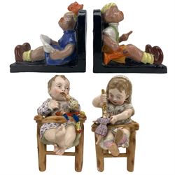 Pair of Art Deco Hungarian bookends by Komlós, modelled as a seated girl and boy, H16cm together with a pair of Continental porcelain models of infants in high chairs, H22cm 