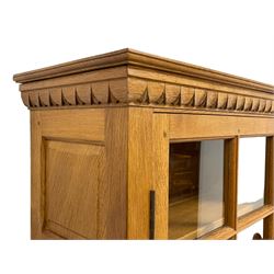 Wrenman - oak dresser, projecting lapit carved cornice, raised display cabinets flanking open centre shelves with acorn and oak leaf carved brackets, rectangular adzed top over three drawers and two panelled cupboards, carved proud wren signature, by Robert (Bob) Hunter of Thirlby