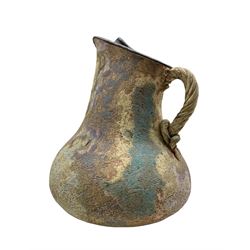 A  studio pottery hand-built ewer with rope-twist handle and textured glaze, bears mark resembling that of Michael Casson (British 1925-2003) H31cm 