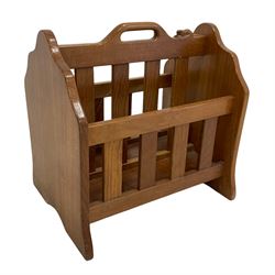 'Beaverman' oak two division magazine rack, the top rail carved with beaver signature and pierced with handle, shaped end supports, by Colin Almack of Sutton-under-Whitestonecliffe