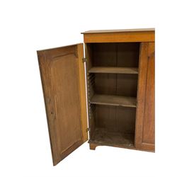 Early 19th century oak cupboard, enclosed by two panelled doors with moulded slips, the interior fitted with adjustable shelves, on bracket feet