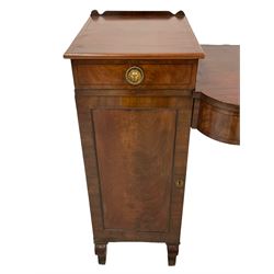 Regency mahogany twin pedestal sideboard, the central curved rectangular section with crossbanding and ebony stringing fitted with two drawers, each pedestal fitted with single drawer over panelled cupboard door, one side enclosing cellarette drawer, the handles brass lion heads with beaded rings, raised on shaped feet