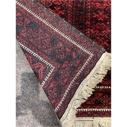 Red afghan rug, with six panels on red field, geometric decoration to border, 204cm x 113cm