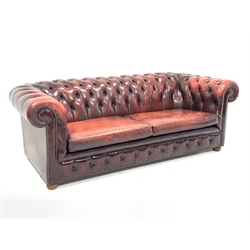 Late 20th century three seat chesterfield sofa upholstered in deeply buttoned red leather, W225cm, D98cm