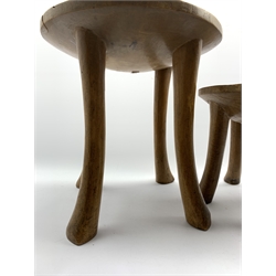 East African Kamba stool, the circular top with beaded decoration D36cm and another with animal and bird decoration D26cm