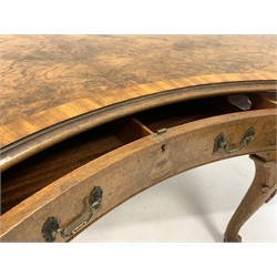 Early to mid 20th century Georgian style large walnut kidney shaped library table, the cross banded and moulded top over frieze fitted with five drawers, raised on leaf and shell carved cabriole supports with ball and claw feet