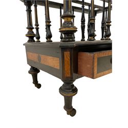 Edwards & Roberts (London 1845-1899) - late 19th century ebonised and parcel gilt Canterbury, with three divisions on turned and fluted supports, canted rectangular form fitted with drawer, with figured bandings, on turned supports with brass and ceramic castors, the drawer stamped 'Edwards & Roberts, Wardour St., London' 