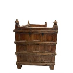 Large Indian hardwood bench, the panelled back and arm terminals over seat with hinged door for storage, raised on stile supports W145cm, H100cm, D77cm