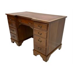 Merryweather of Holloway London - early Edwardian mahogany twin pedestal breakfront desk, inset leather writing surface, fitted with central frieze drawer and flanked by eight graduating drawers, bracket feet with castors