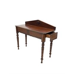 Victorian mahogany hall table, the arched raised back with floral roundel over rectangular top with moulded edge and canted corners, drawer to one end, shaped apron, raised on ring turned and tapering supports W105cm