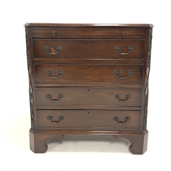 Early 20th century walnut chest, with brushing slide over four drawers, canted corners with applied carved detail, raised on shaped bracket supports, W76cm, H83cm, D47cm