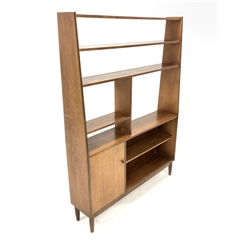 Mid 20th century teak room divider, fitted with open shelves and a cupboard, raised on turned supports, W122cm, H167cm, D29cm
