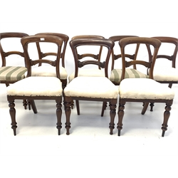 Matched set of eight Victorian mahogany dining chairs, with shaped cresting rail over floral carved back rails, seats ready for upholstery, raised on turned front supports 