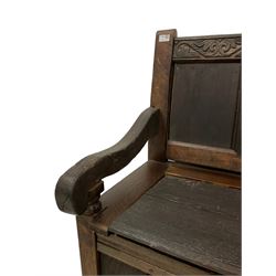 18th century and later settle, the cresting rail carved with scrolled foliage over four panelled back, lift up box seat, scrolled arms on turned supports panelled front and sides 