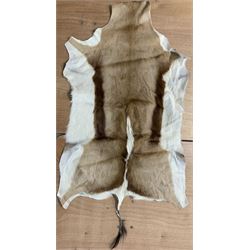 Hides / Skins: Three good quality hides comprising Kudu, impala and black and white cow max 164cm x 140cm