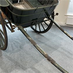 Thomas Cuthbert & Son, Dundee (Scottish 19th century) - Victorian Governess Cart, wooden tub shaped body in dark green painted finish with yellow pinstripe, step-plate and rear access door to the interior with horsehair stuffed upholstered backrests, rubber tyred 16 spoke wheels stamped 'T Cuthbert & Son Dundee' to the hubcaps, fitted with two sconces to the front and 200cm shaft forearms