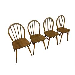 Ercol - set four elm and beech 'Windsor Dining Chairs', hoop stick back over splayed and tapered supports united by H-stretcher