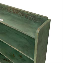 Green painted bookcase, tapered form and fitted with three shelves, with geometric carved decoration, painted and waxed finish