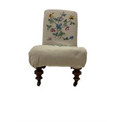 Late 19th century mahogany framed nursing chair, upholstered in floral needlework upholstery, on turned supports