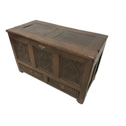 18th century oak mule chest, rectangular hinged top with moulded edge, the three fielded panel front carved with lozenges and foliate motifs, the two drawers to the base heavily carved with gadroon decoration, on stile supports