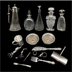 Victorian silver-plated mounted glass claret jug, a globular ribbed glass decanter, another decorated with cut stars, two silver-plated bottle coasters, set of 19th century candle snuffers, pair of Victorian fish servers, together with other silver-plate and glassware 