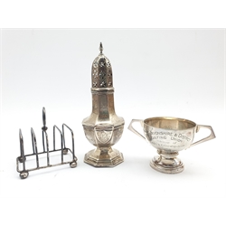 Silver panel sided sugar castor Chester 1921, small silver two handled trophy and a four division toast rack 9.9oz