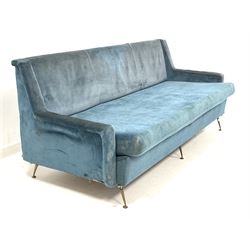 Large 1960s three seat sofa, upholstered in blue velvet fabric with loose cushion, raised on slender angled brass supports W212cm, H86cm, D83cm
