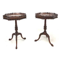Pair of Georgian style mahogany lamp tables, octagonal pierced fretwork tray tops over carved aprons and leaf carved columns, raised on three carved splayed supports W48cm