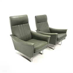 Pair of continental armchairs, upholstered in green leather, with loose cushions, raised on flat bar chrome supports, W74cm