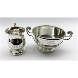 Late Victorian silver two handled trophy inscribed 'Walking Foxhound Puppy' presented by Earl Manvers D10cm London 1900 Maker Goldsmiths and Silversmiths Co and a small silver christening mug Sheffield 1956 10.6oz