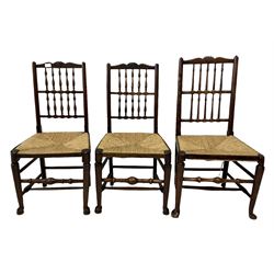Set six spindle back chairs with rush seats, raised on turned supports 