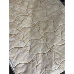 Large quilted bedspread with machine embroidered scroll decoration, L266cm x W270cm, another with floral design, L265cm x W240cm and one other (3)