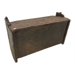 17th century design Continental oak chest or coffer, the rectangular top pegged and hinged, the hewn surface carved with foliate decoration, front carved and tooled with central stylised flower head and flanking floral patterns, on stile feet