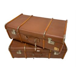 Two vintage wood bound travelling trunks in brick red colour 