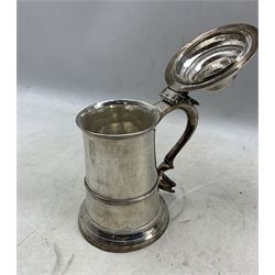Early George III silver lidded tankard, the domed hinged cover with pierced scroll form thumbpiece and S scroll handle H20cm London 1770 Makers mark I*M possibly Jacob Marsh 28oz