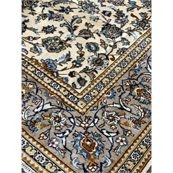 Persian fine Kashan ivory ground carpet, with repeating floral motif enclosed by multi line border,  288cm x 202cm
