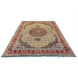 Persian Mood carpet, ivory, blue and red ground, large central medallion on Herati field, repeating guarded border decorated all over with stylised flower and plant motifs