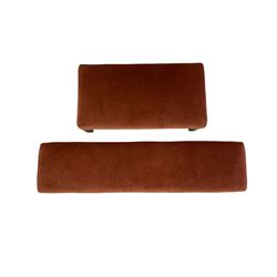 Two rectangular footstools upholstered in red fabric 