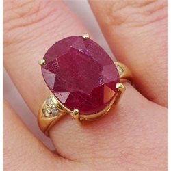 Gold single stone oval ruby ring, with diamond set shoulders stamped 18ct, ruby approx 7.00 carat